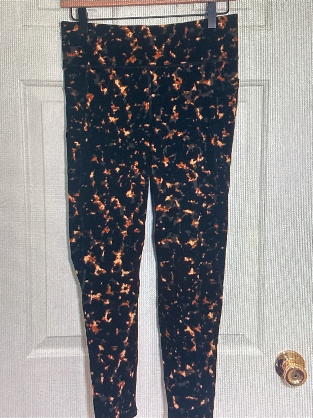 Sweaty Betty Black Leggings with Orange Marble Accents